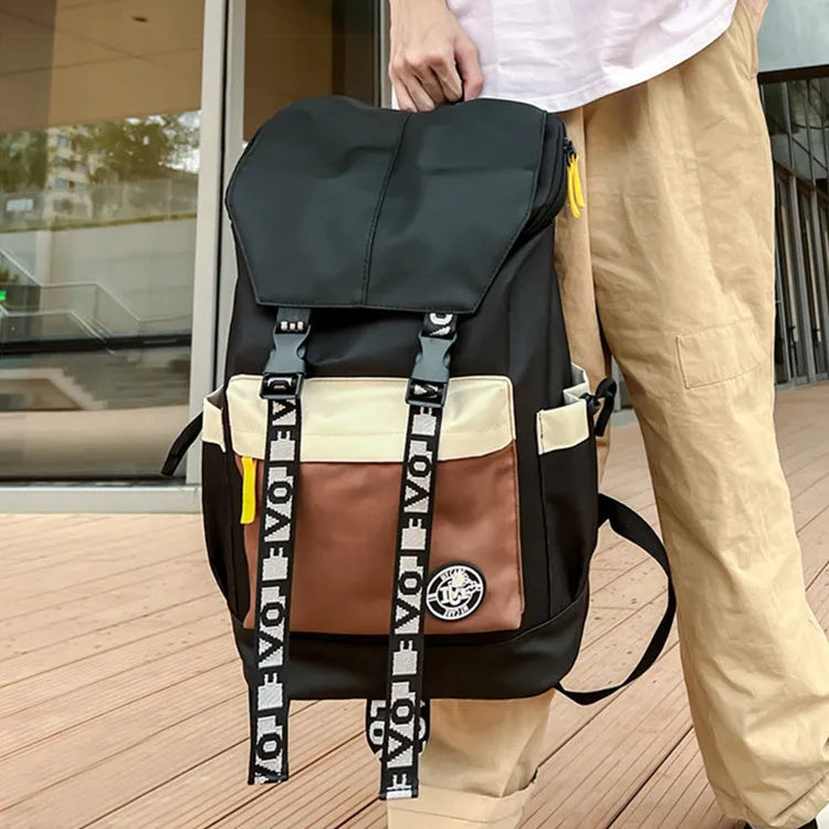 Oxford cloth school backpack in black, green, or red colour options.