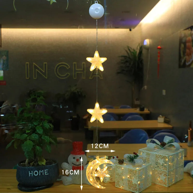 Set of three Christmas LED star window lights with suction cups on a glass window, warm glow, plastic housing, battery operated