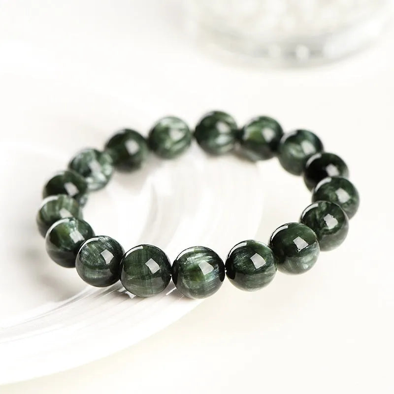 Green Dragon Crystal bracelet with round beads and a ruyi decorative motif.