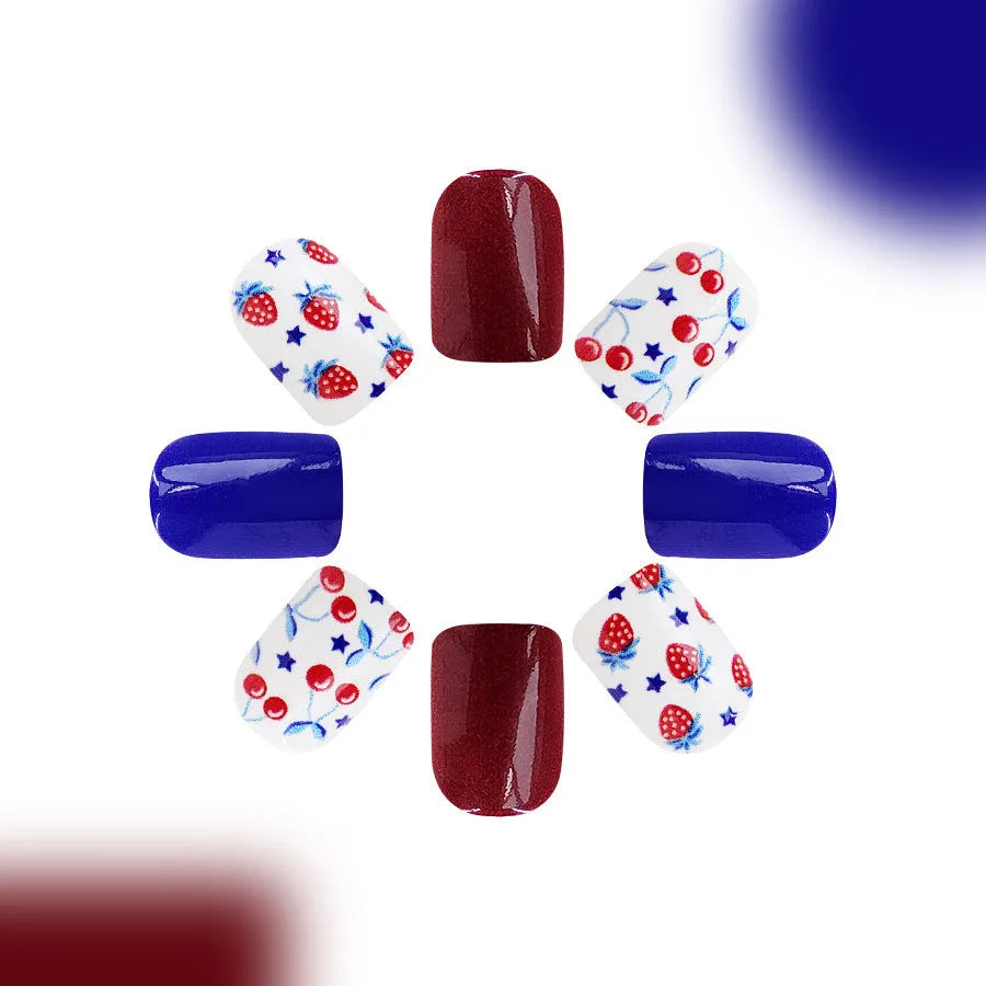 Short glossy red and blue strawberry cherry false nail stickers Independence Day themed 24 piece set.