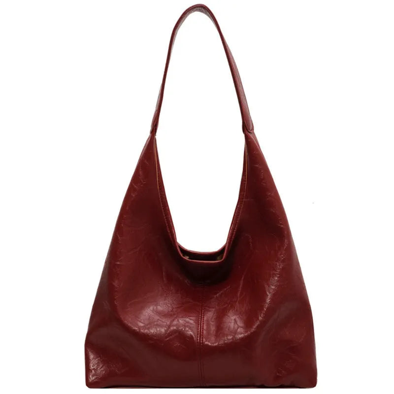 Casual soft PU leather large capacity shoulder bag in street style with sandwich pocket.