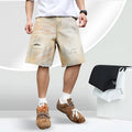 Men's light blue ripped denim shorts with washed old vintage styling