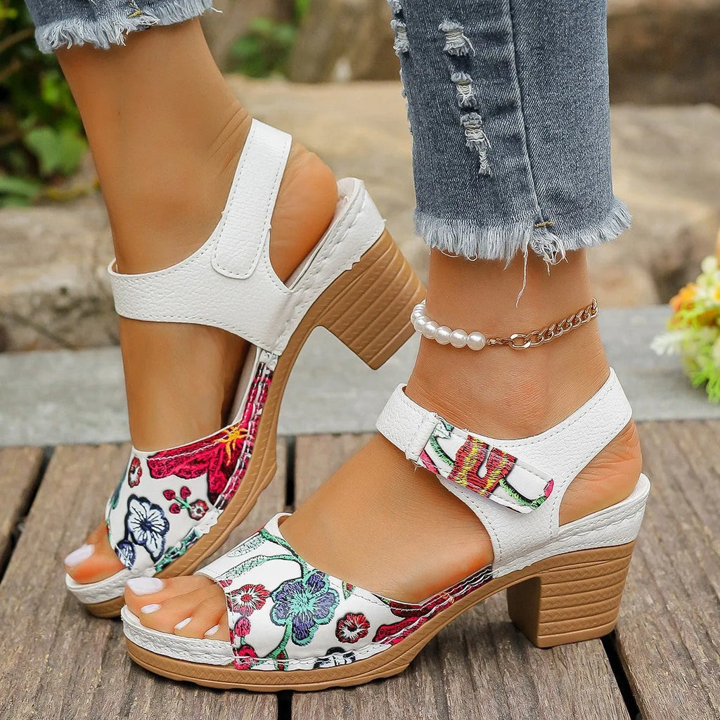 White women's casual sandals with high heel, Velcro buckle straps, and rubber sole.