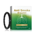 Close-up of a men's adjustable bracelet with black gallstone beads and clear glass spacers on a cord.
