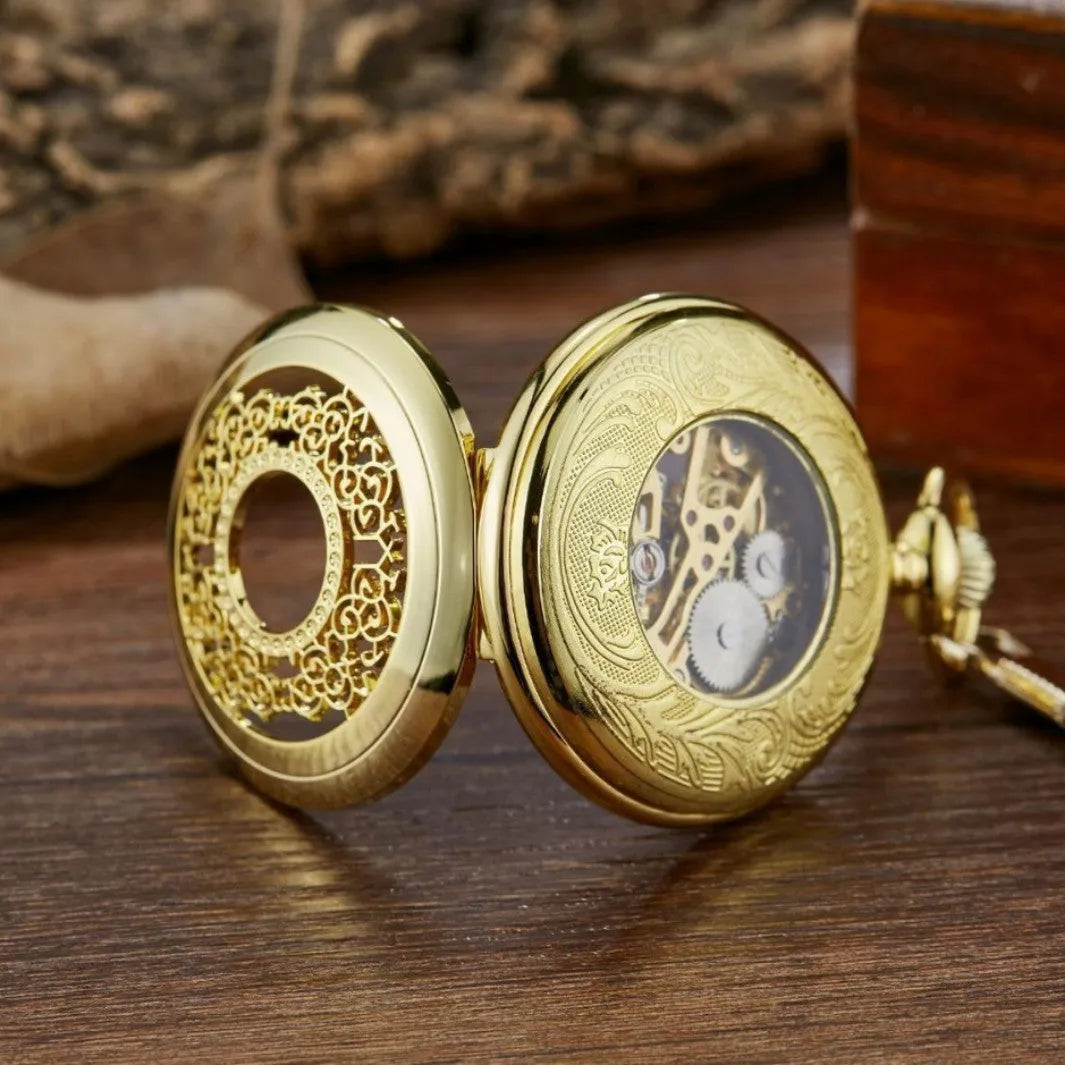 Retro automatic mechanical pocket watch with floral print dial and transparent back in gold colour.