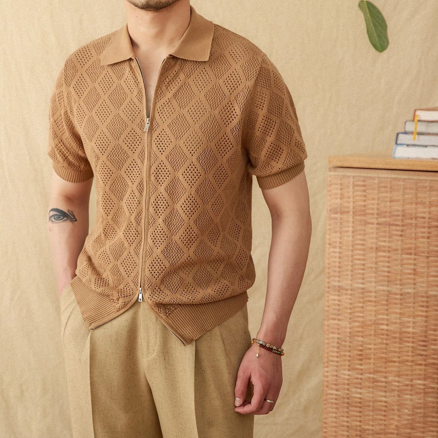 Light brown cotton short sleeve cardigan with lapel collar and full-length front zipper.