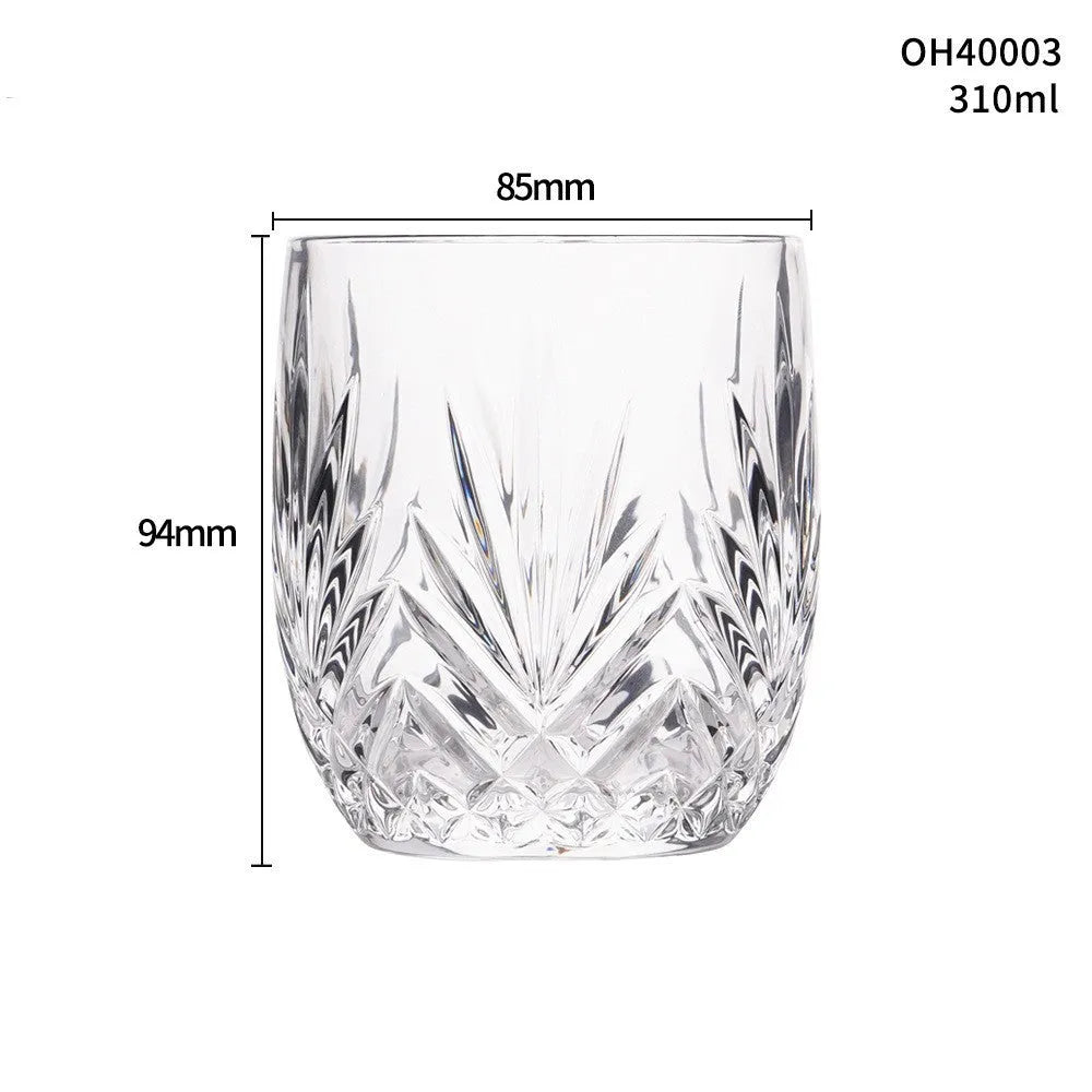Thick bottom crystal whiskey shot glass in a selected colour style on a table.
