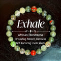 Handmade African Bloodstone beaded bracelet with 8mm transparent glass beads on neutral background