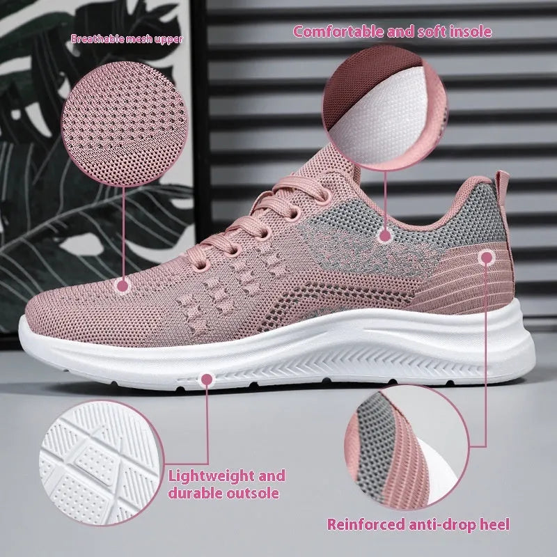 Women's black mesh low-top sneakers with round toe and white PVC sole on a neutral background.