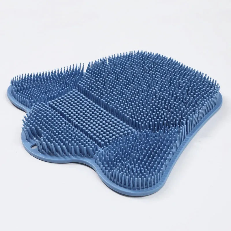 Blue silicone bath scrub mat for back washing, measuring 31cm by 32cm, mounted on a shower wall.