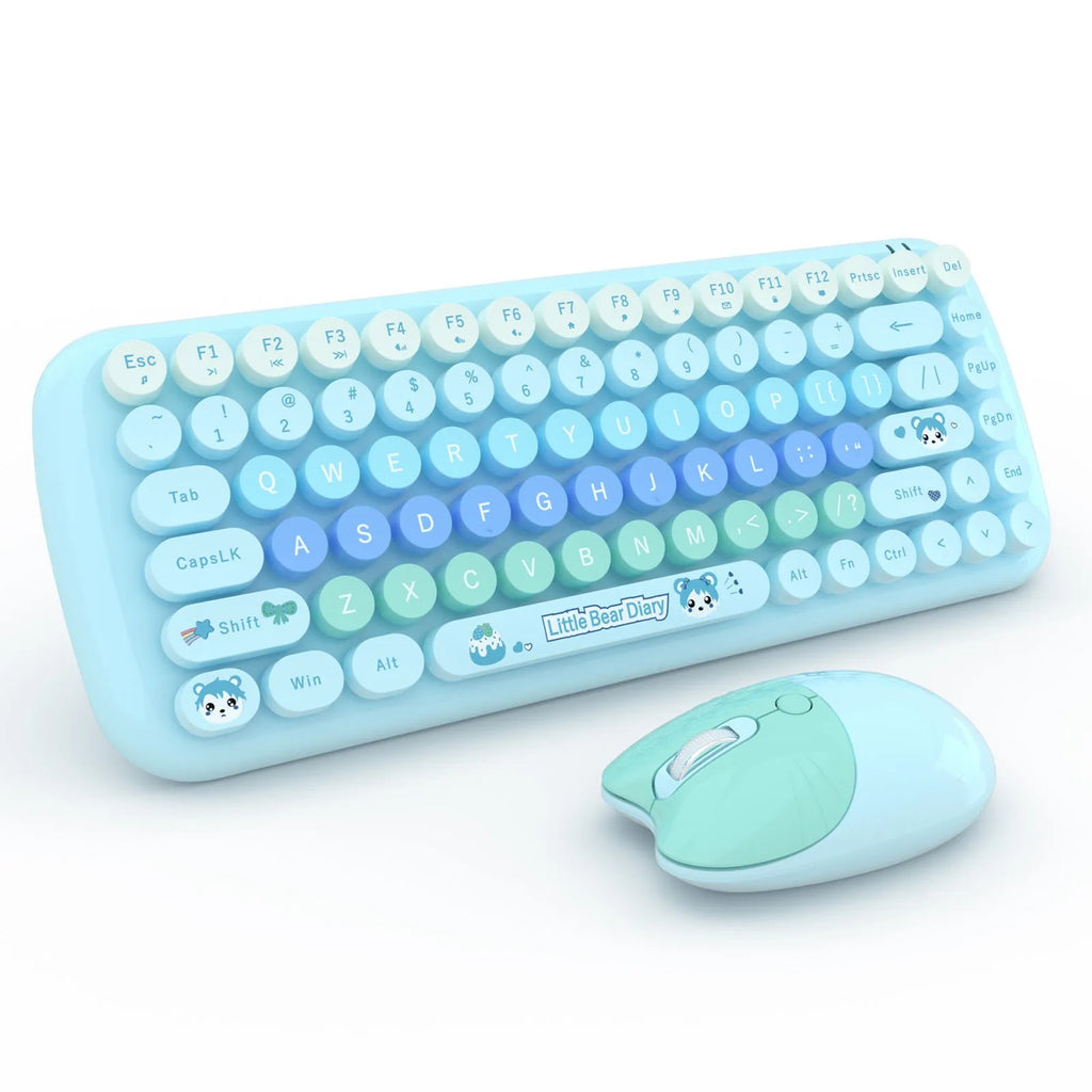 Pink mini wireless keyboard and mouse set with cute cartoon design on a desk.