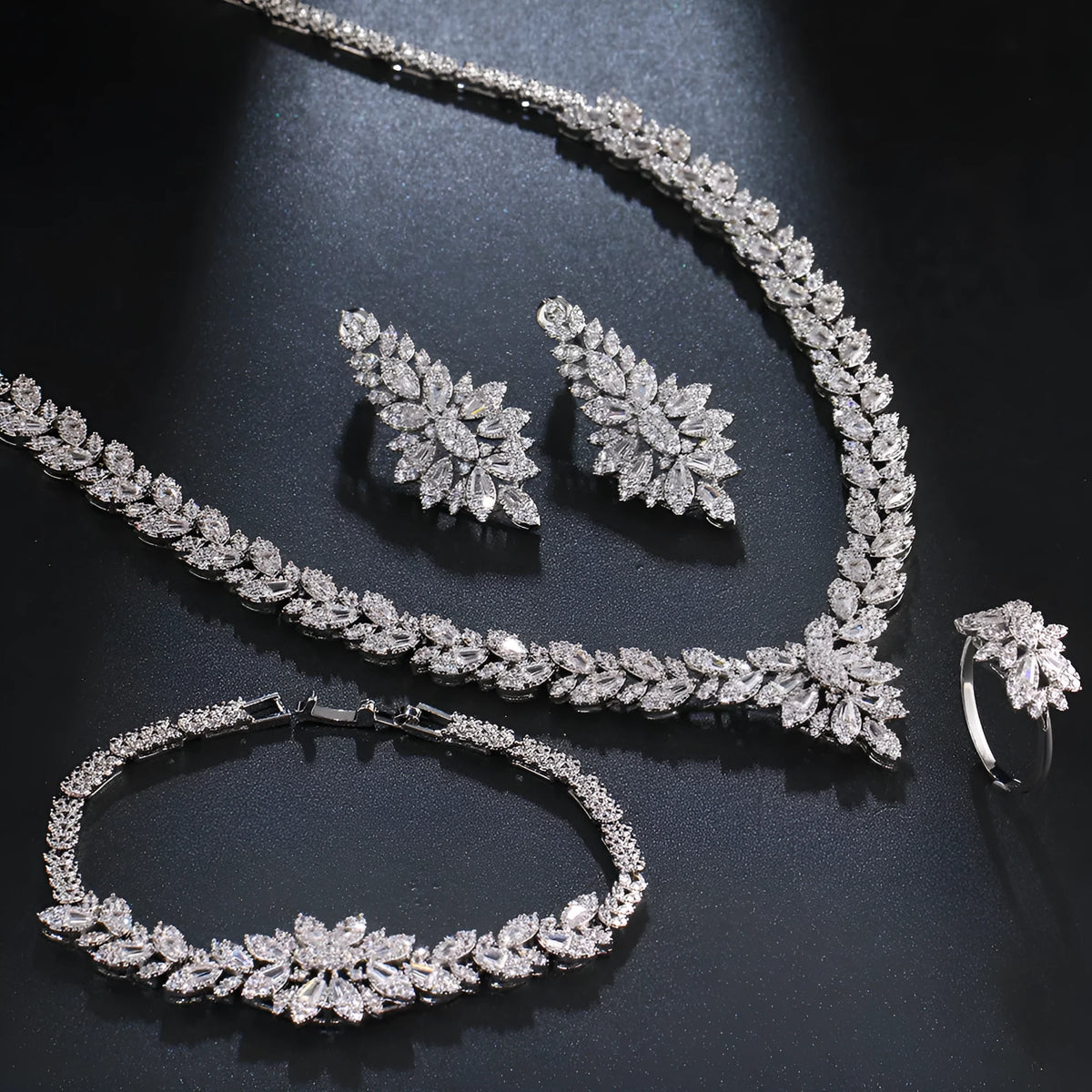White copper bridal jewellery set with tassel earrings, necklace, bracelet, ring and snake bone chain