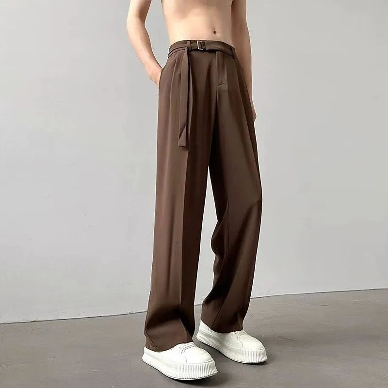 Black straight leg loose fit casual trousers on a hanger, front view.