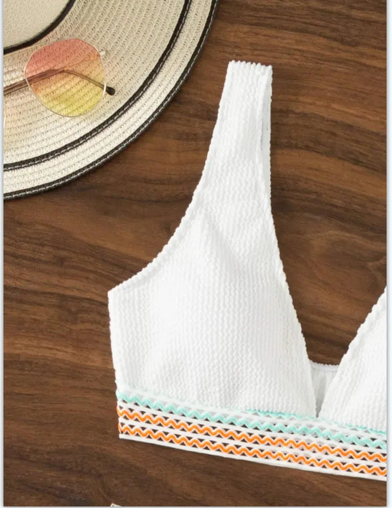 White high waist bikini set with sleeveless top on a mannequin