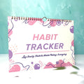 Habit tracking journal with 12 pages measuring 21cm by 28cm in four colour options
