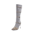 Grey and black women's knee-high boots with a high heel and velvet lining.