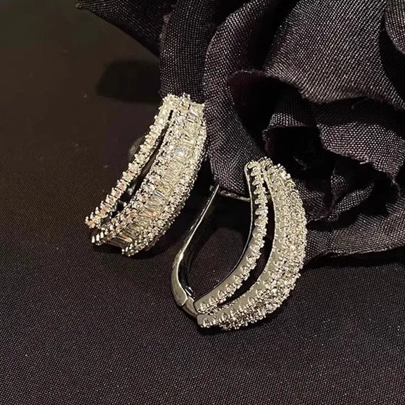 Geometric stud earrings with white gold colour finish and inlaid zircon stones