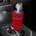 Compact white car air purifier and humidifier unit with USB cable on a car dashboard.