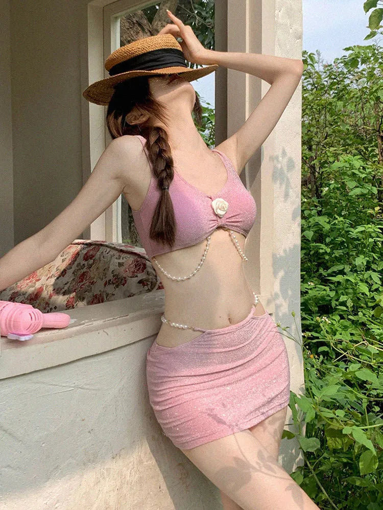 Women's pink three-piece bikini set with backless briefs for swimming and hot spring use