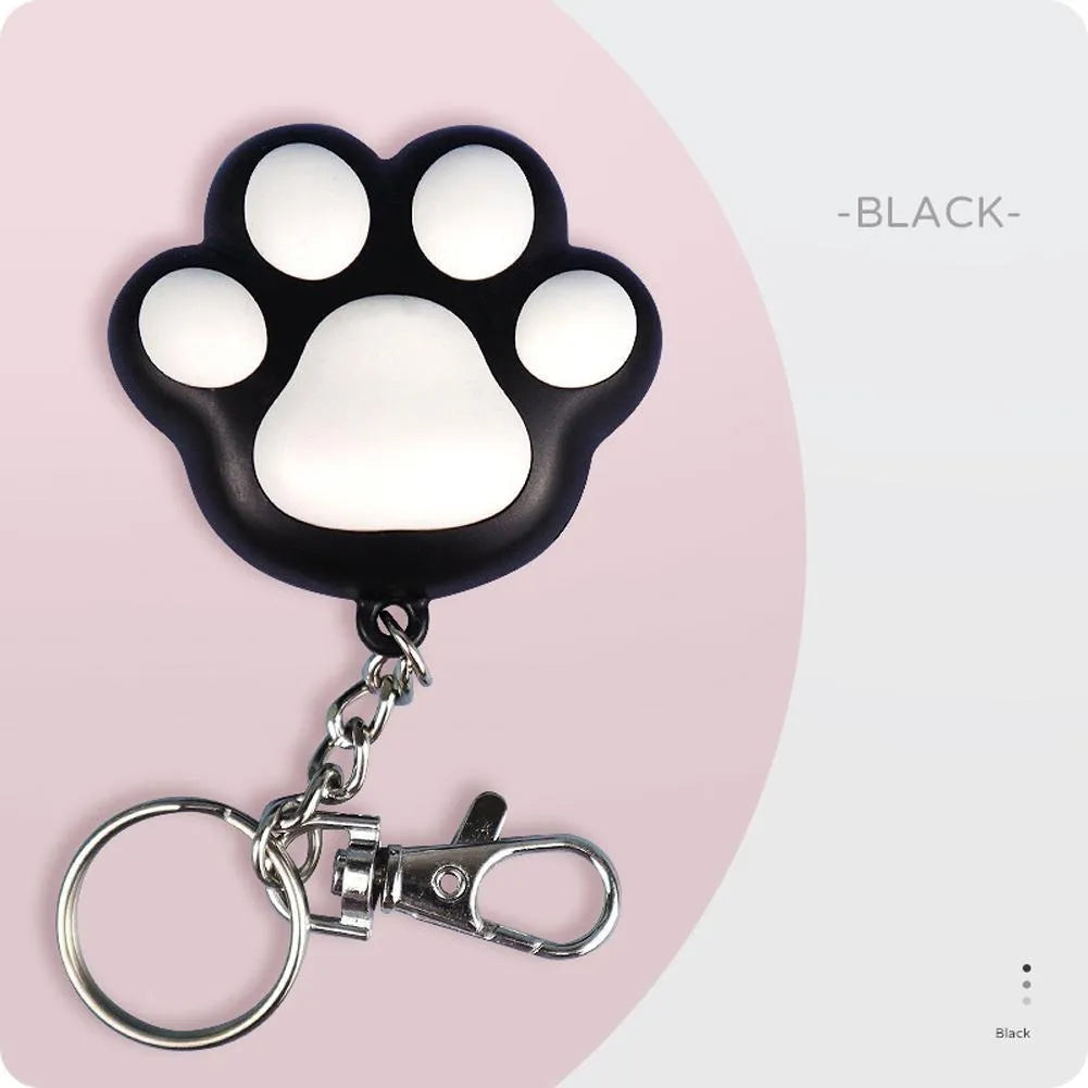 Pink and black USB-rechargeable infrared cat teaser toy with keychain loop.
