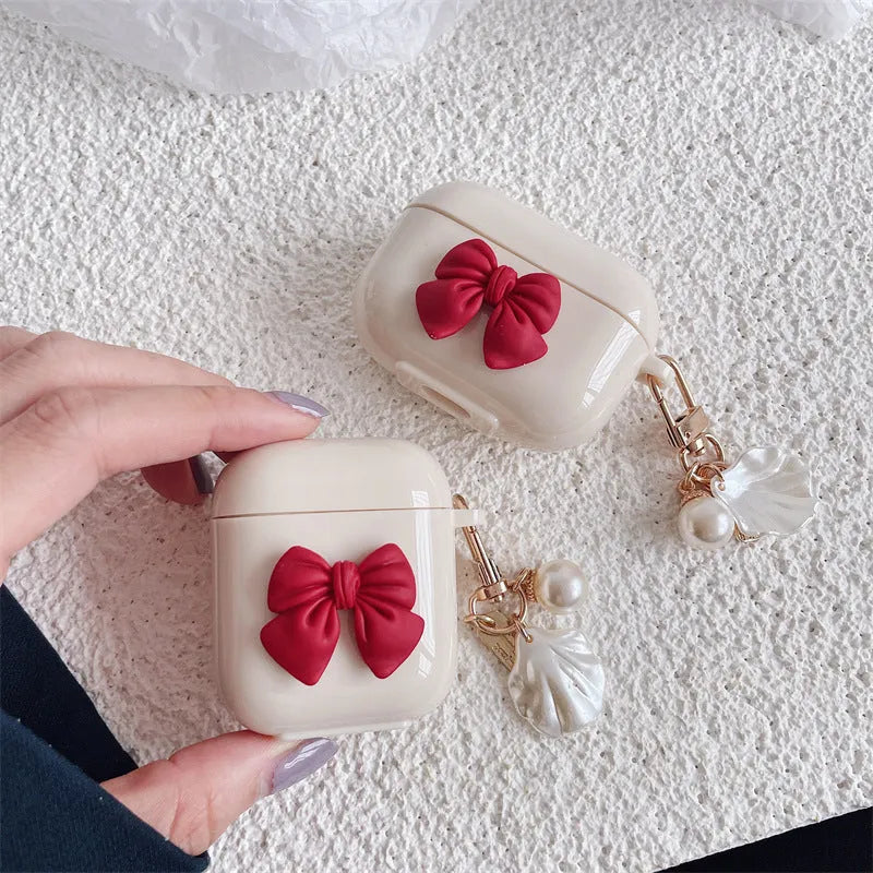 Beige red bow shell pendant TPU case for Apple AirPods wireless earphones with clamshell design