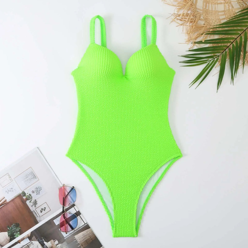 Women's black sleeveless one-piece swimsuit with a sunken stripe pattern on the front.