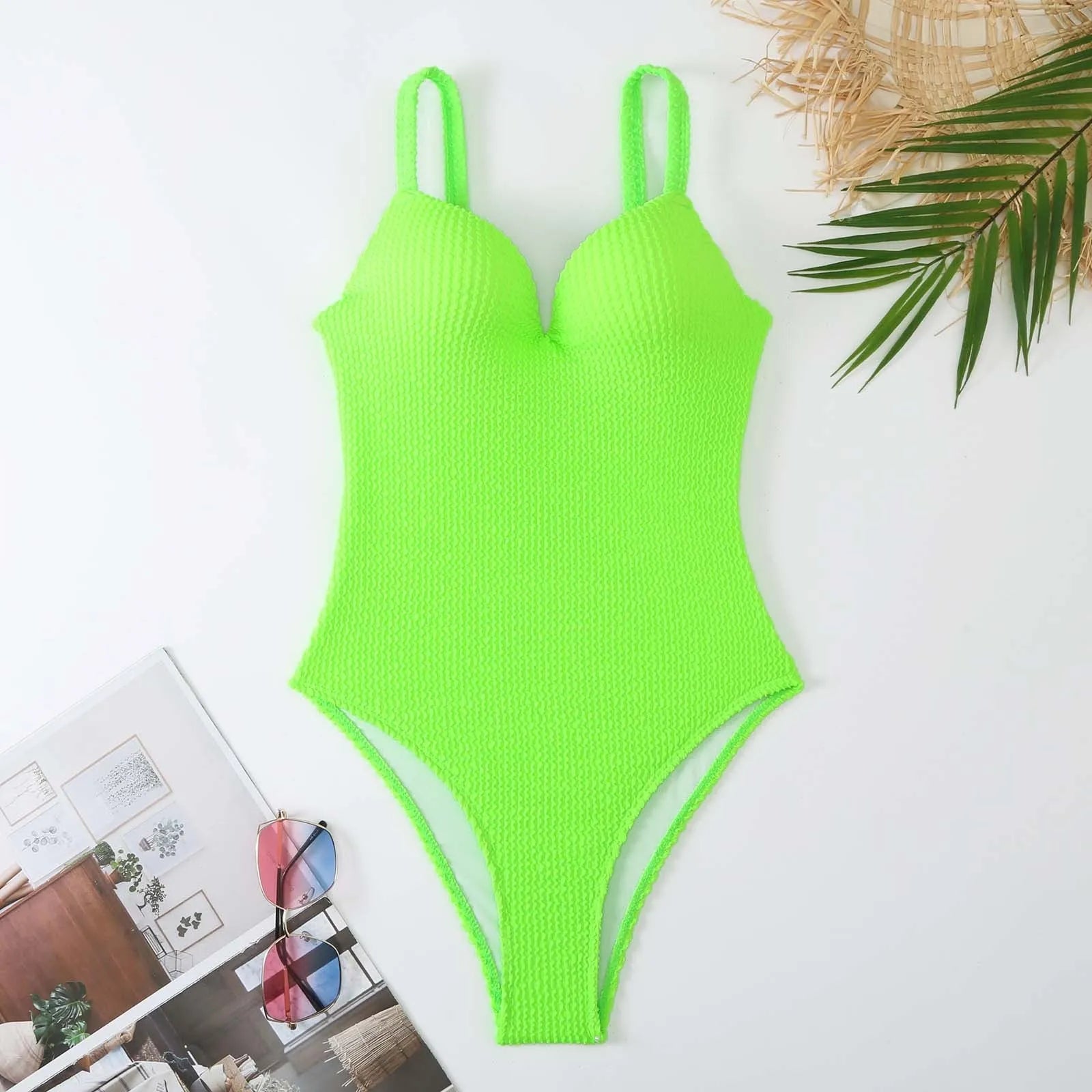 Women's black sleeveless one-piece swimsuit with a sunken stripe pattern on the front.