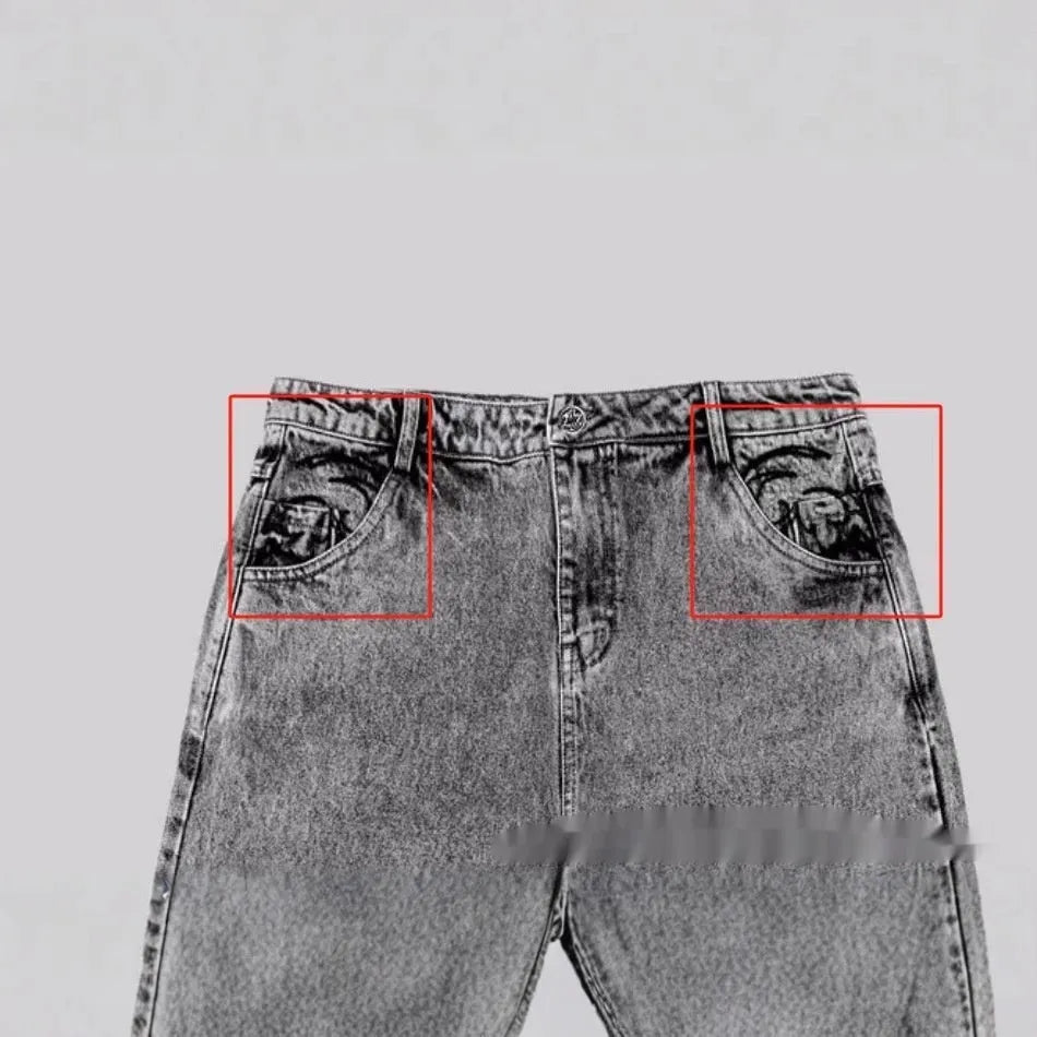 Grey loose straight-leg denim trousers for men and women laid flat, showing mid waist and classic cut.