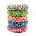 Close-up of a cotton braided ring knot toy for dogs, approximately 18cm diameter, made from cotton thread in a random colour