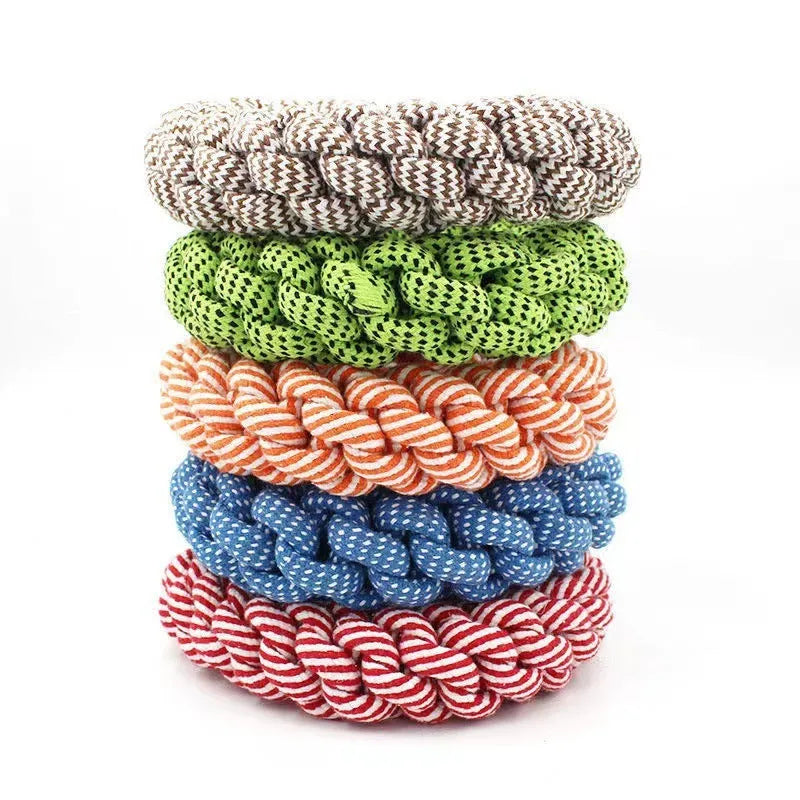 Close-up of a cotton braided ring knot toy for dogs, approximately 18cm diameter, made from cotton thread in a random colour