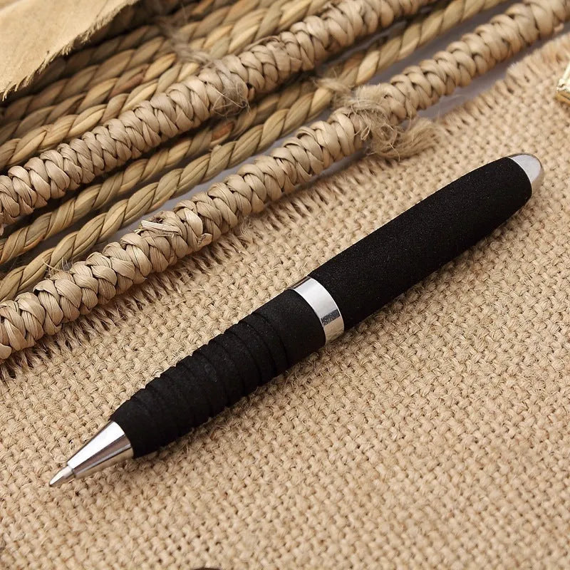Metal ballpoint pen with bullet tip shown alongside seven refill colour options