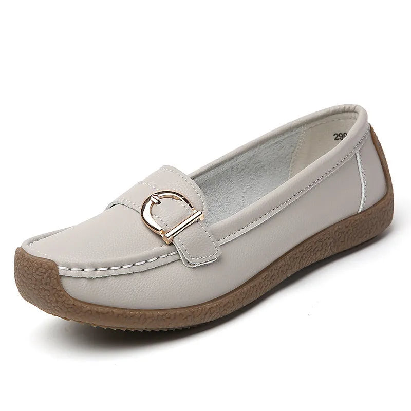 Women's beige casual loafers with round toe and flat beef tendon sole on a white background.