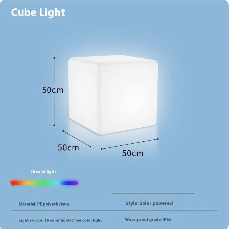 Square LED cube stool light in garden setting showing modern design with lighting