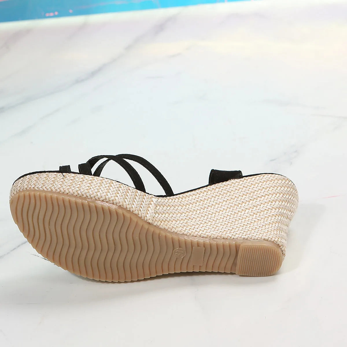 Women's beige fabric wedge sandals with fish mouth toe opening on wooden floor