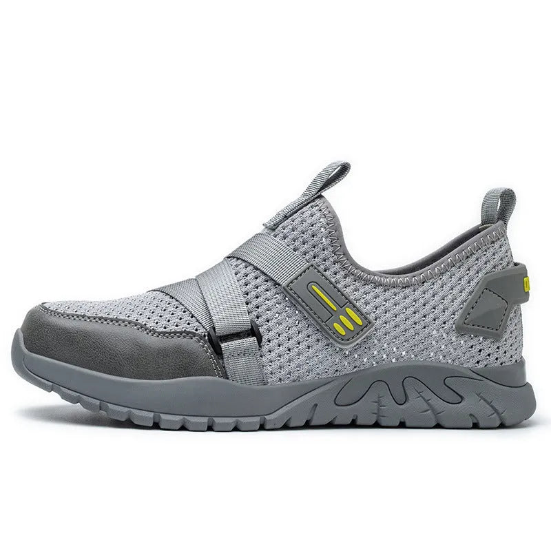 Men's grey anti-smash and anti-puncture safety shoes with a flying woven upper and rubber sole.