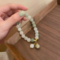 Multi-layer beaded bracelet with small rice-shaped white round beads, handmade ethnic style for women