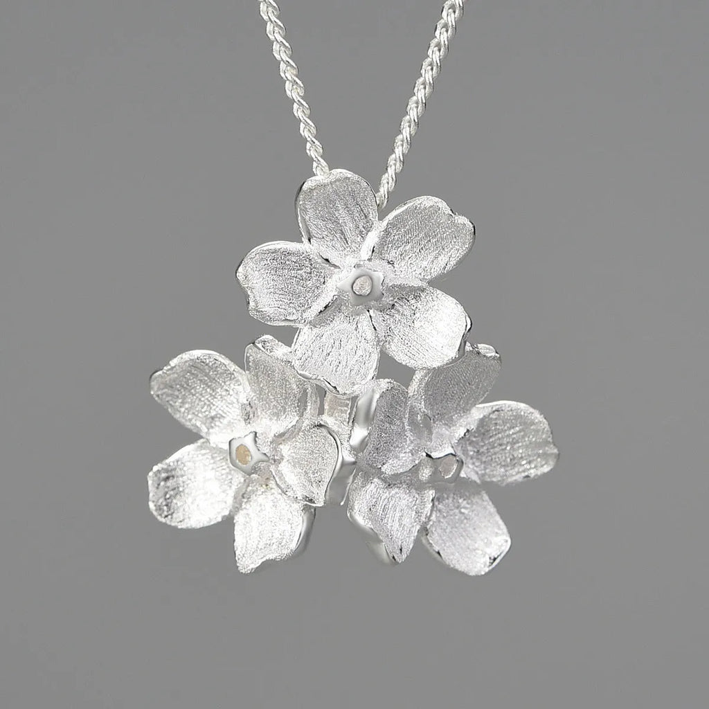 Hand-designed Myosotis Sylvatica flower sterling silver pendant with gold or silver electroplated finish.
