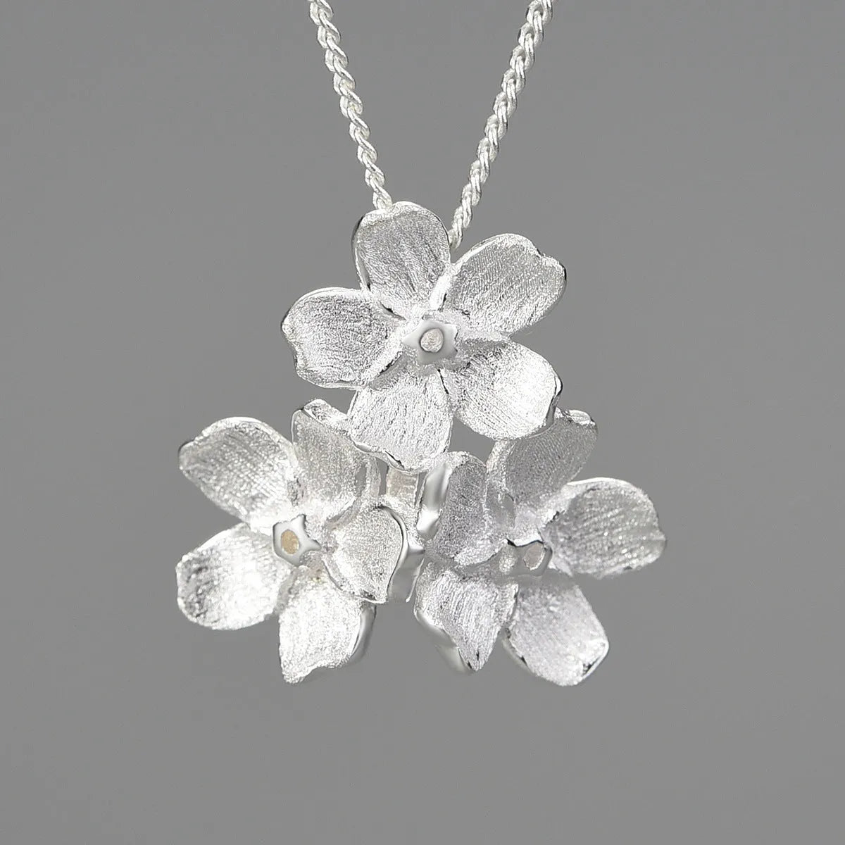 Hand-designed Myosotis Sylvatica flower sterling silver pendant with gold or silver electroplated finish.