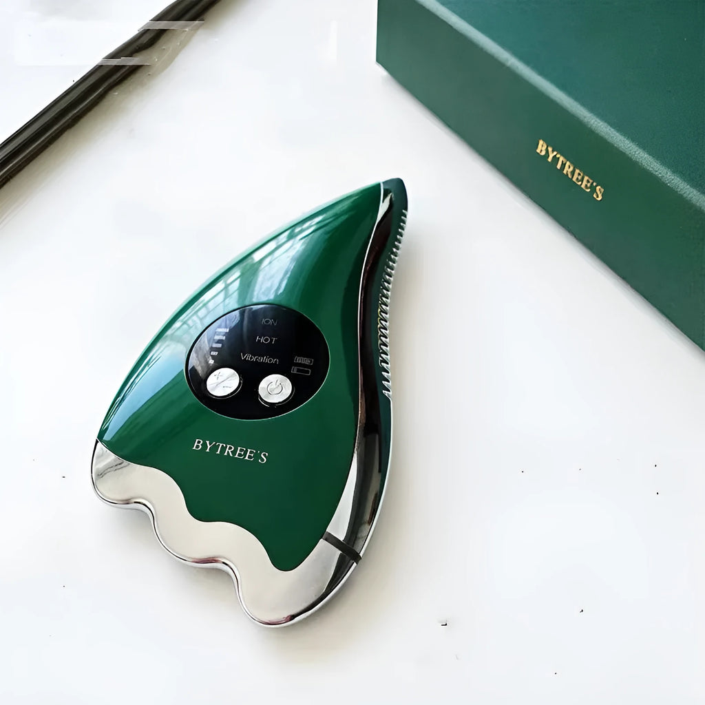 Green facial beauty instrument with vibration, hot and cold modes, and EMS micro current on a table