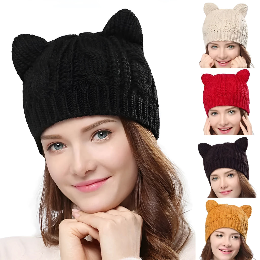 Hand-made red knitted beanie with 3D cat ears on a white background, showing side view.