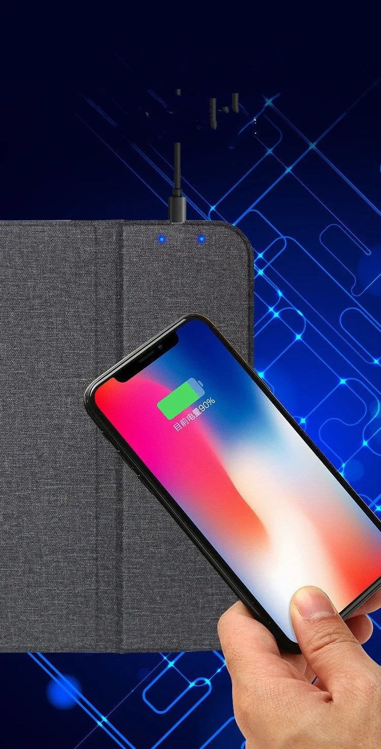 Black 2-in-1 wireless charging mouse pad with non-slip base and phone stand on a desk