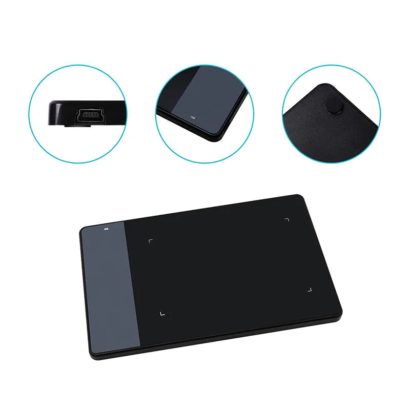 HUION 420 black electronic drawing board with USB cable on desk