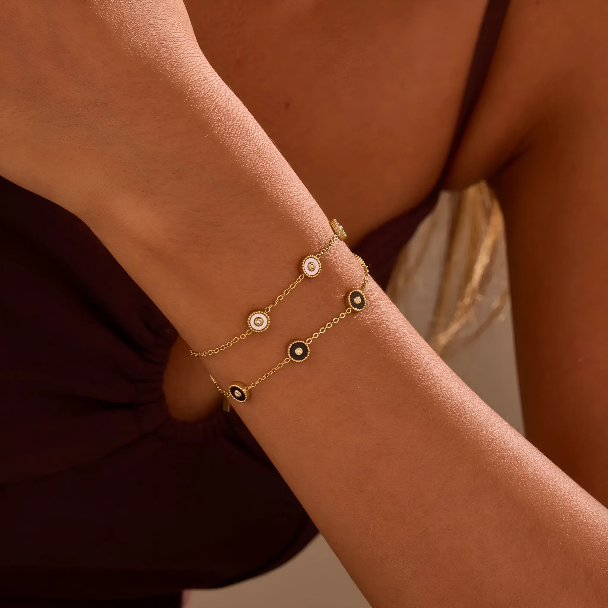Geometric fritillary design bracelet and necklace set with 18K gold plating on stainless steel.