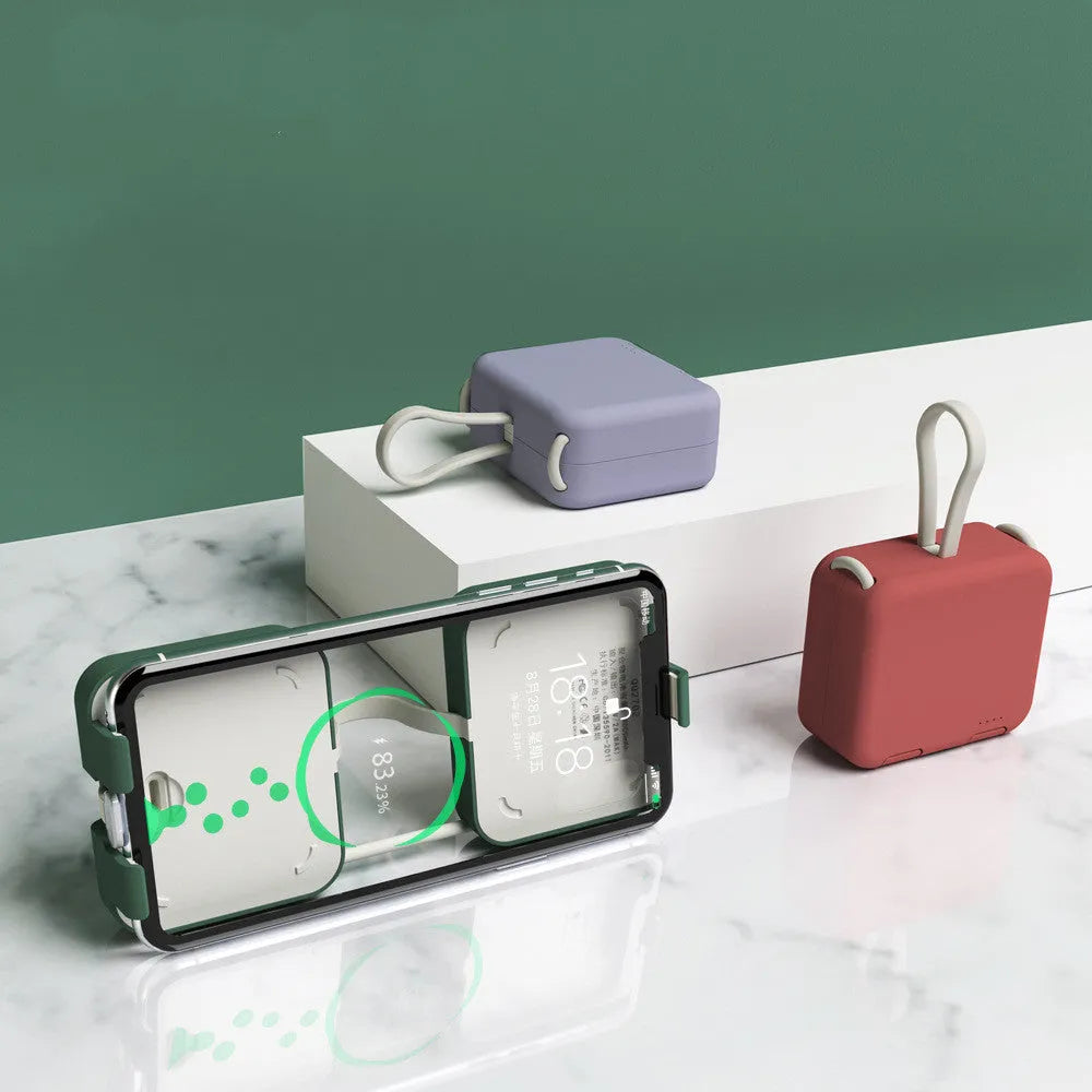 Handbag back clip power bank with flip-out phone stand, shown in blue, green, red, and white colour options.