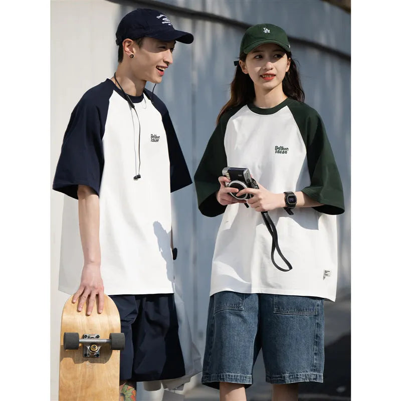Man wearing a loose-fit grey raglan sleeve T-shirt, Japanese casual style.