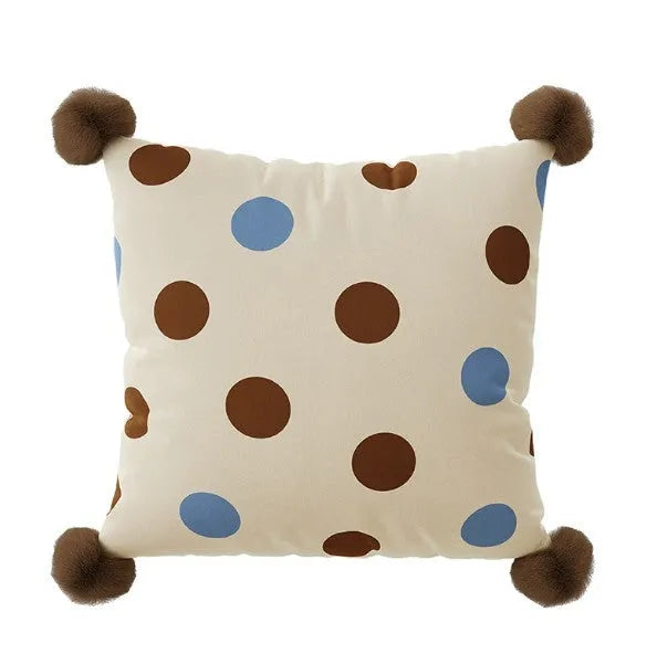 Blue cartoon anime print decorative sofa cushion pillow on a grey sofa.