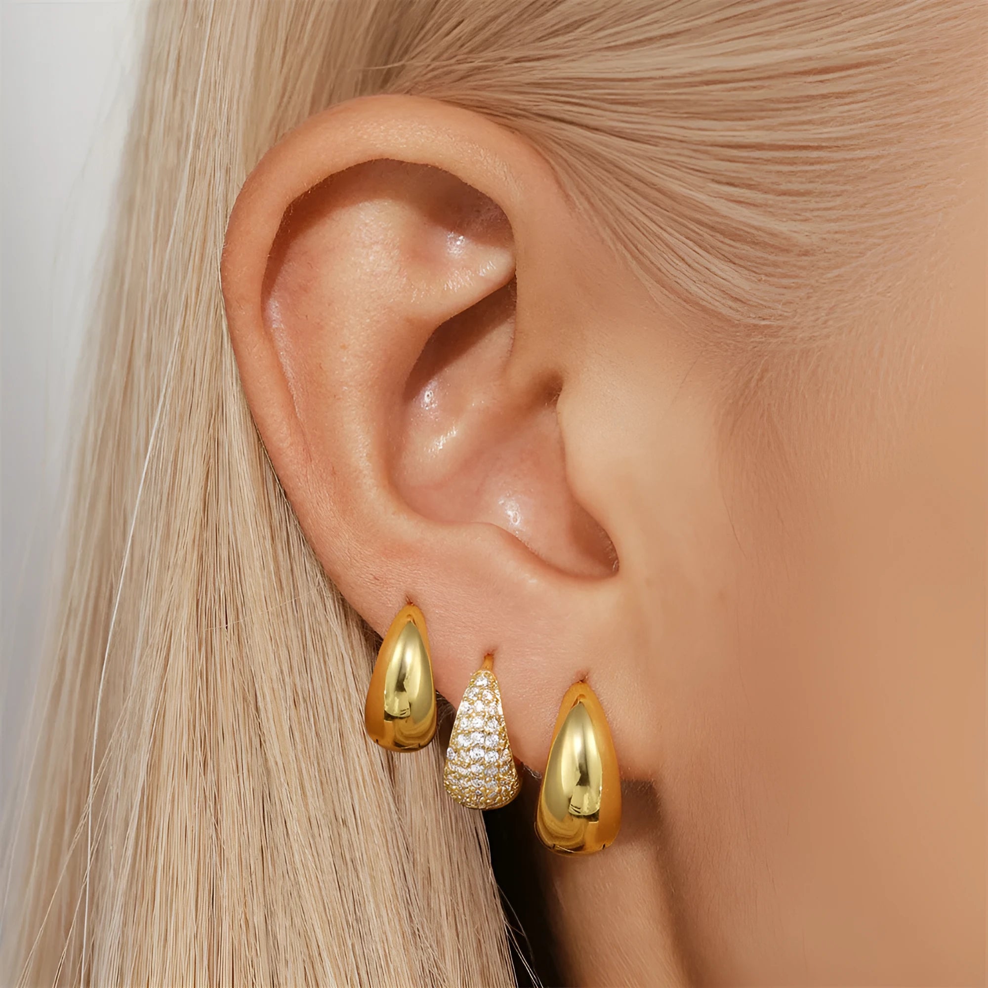 Golden brass diamond earclip earrings with geometric shape and round decorative elements
