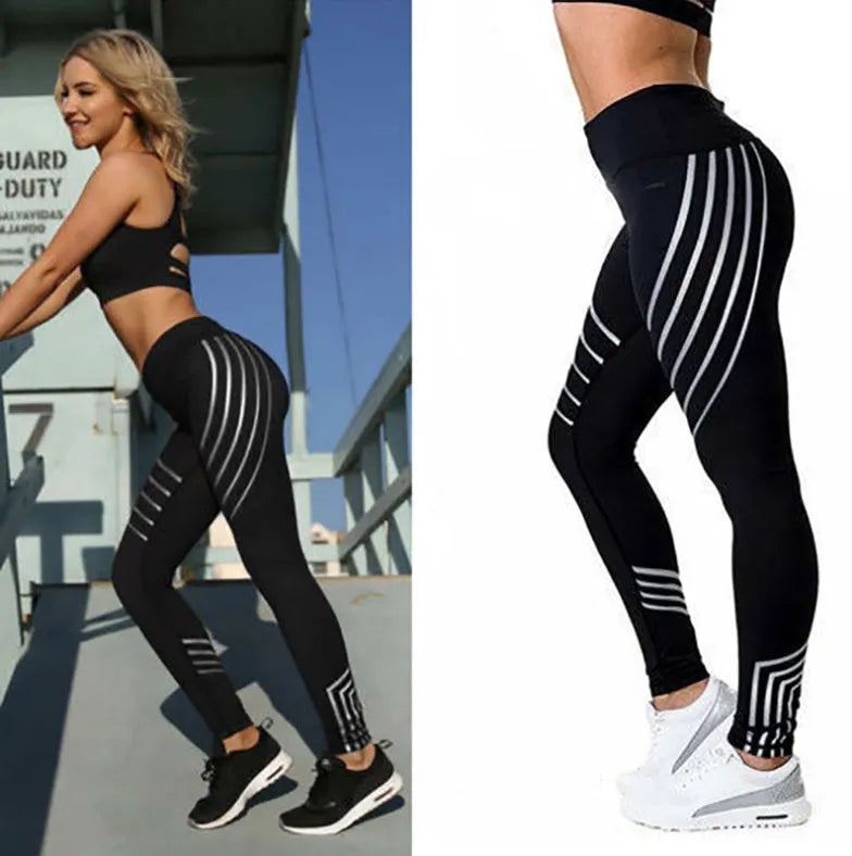 Women's black workout leggings with glowing print design and slim fit pencil pants silhouette