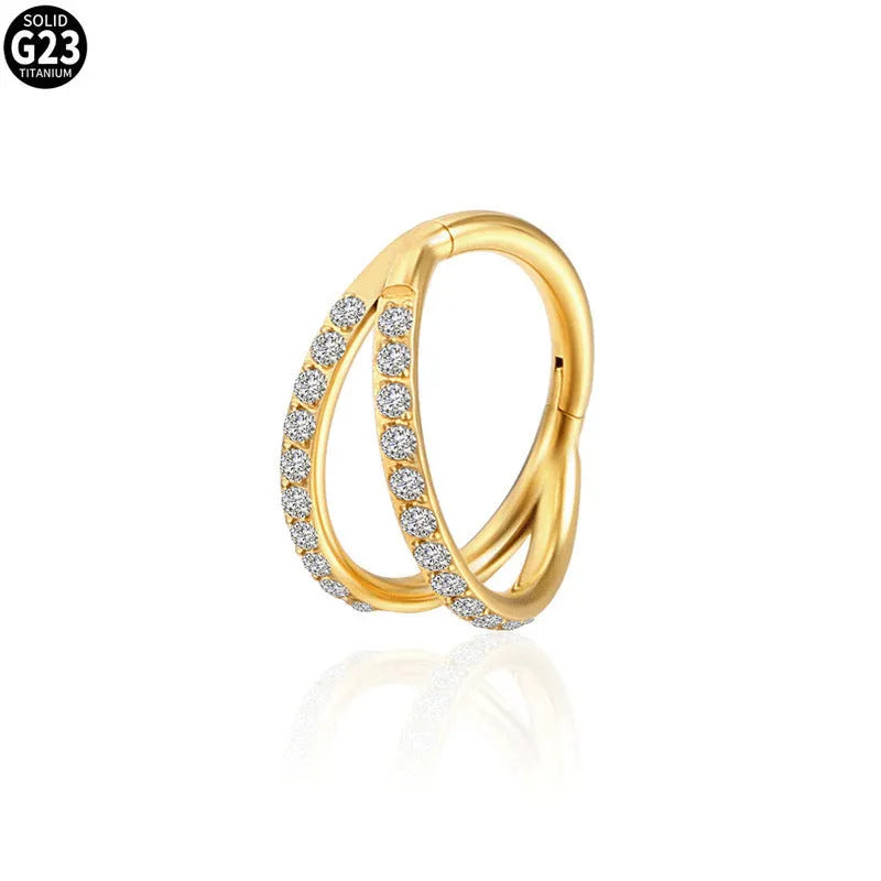 G23 titanium alloy nose ring with zircon accent in steel colour on a grey background.