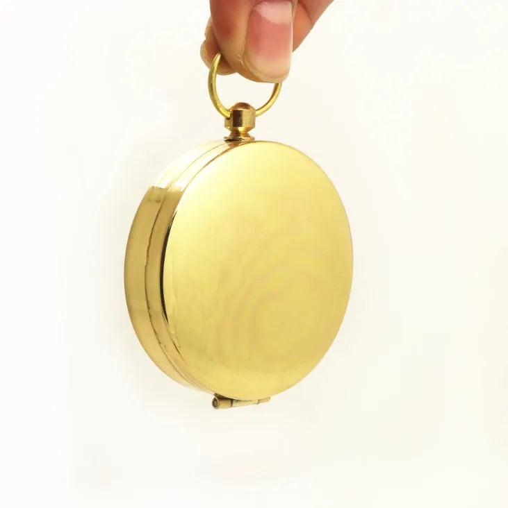 Metal flip compass outdoor pocket watch compass gold colour copper-tone close-up